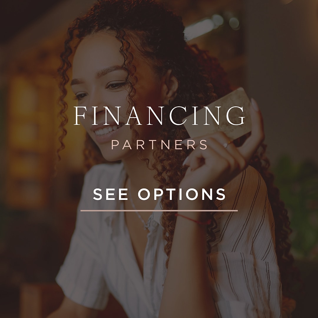 Smiling woman exploring financing options.